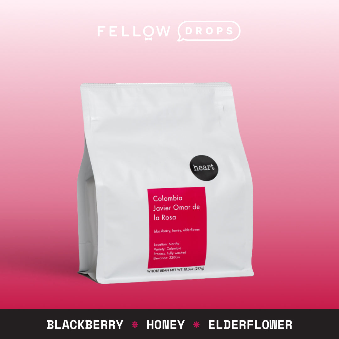 A white Heart Coffee Roasters bag of Javier Omar De La Rosa on a pink gradient background.