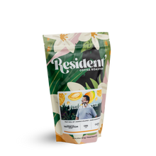 Resident Coffee Juan Puerta Mango bag with floral design and illustrated fruit accents.