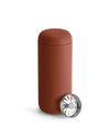 Fellow Carter Move Mug in matte reddish-brown with included metal infuser beside it.