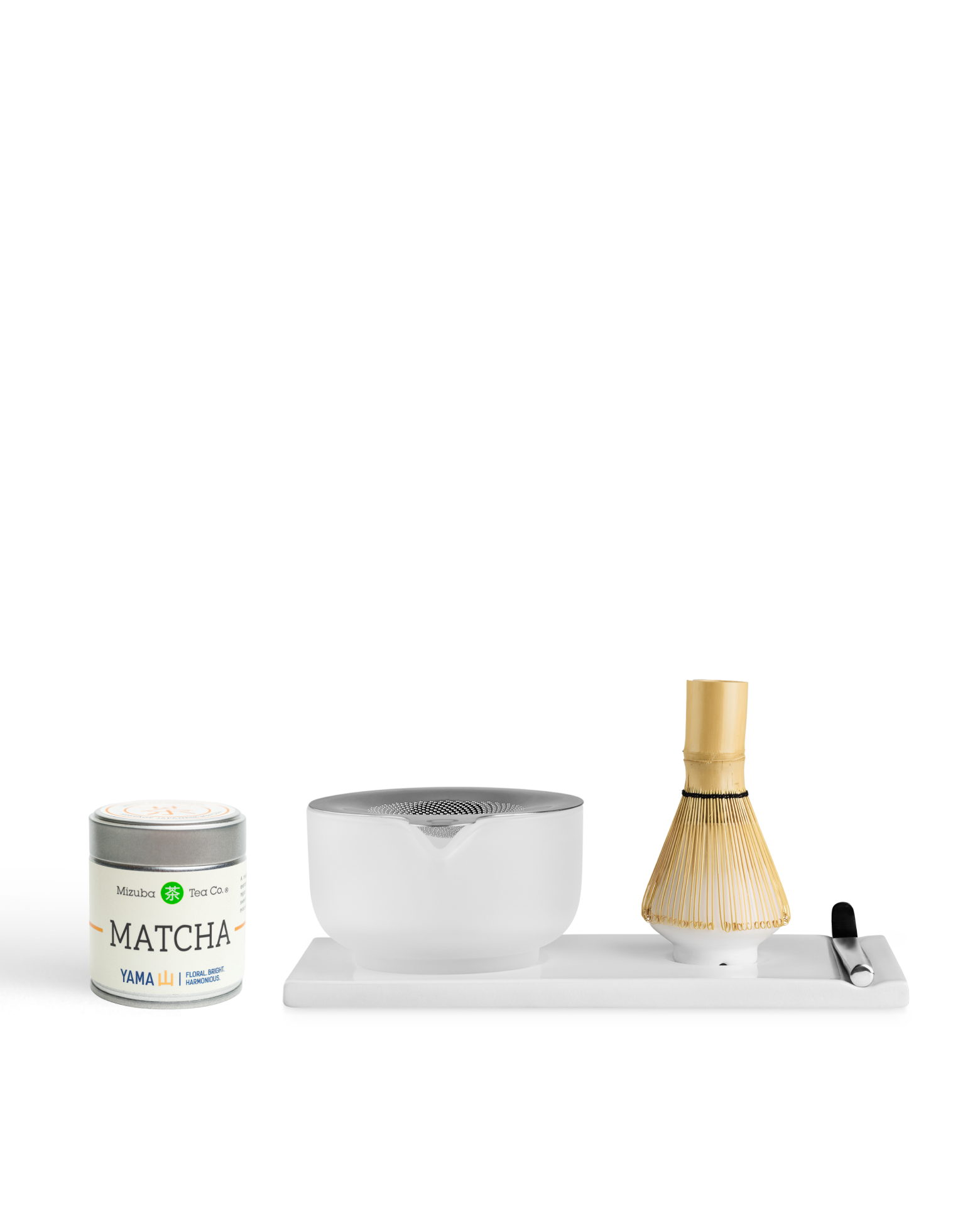 Fellow x Yama Matcha Set: tin, bamboo whisk, spoon, and ceramic bowl on a tray by Fellow.