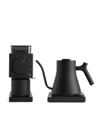 Fellow's The Electric Kit: sleek black kettle and grinder for home baristas, white background.