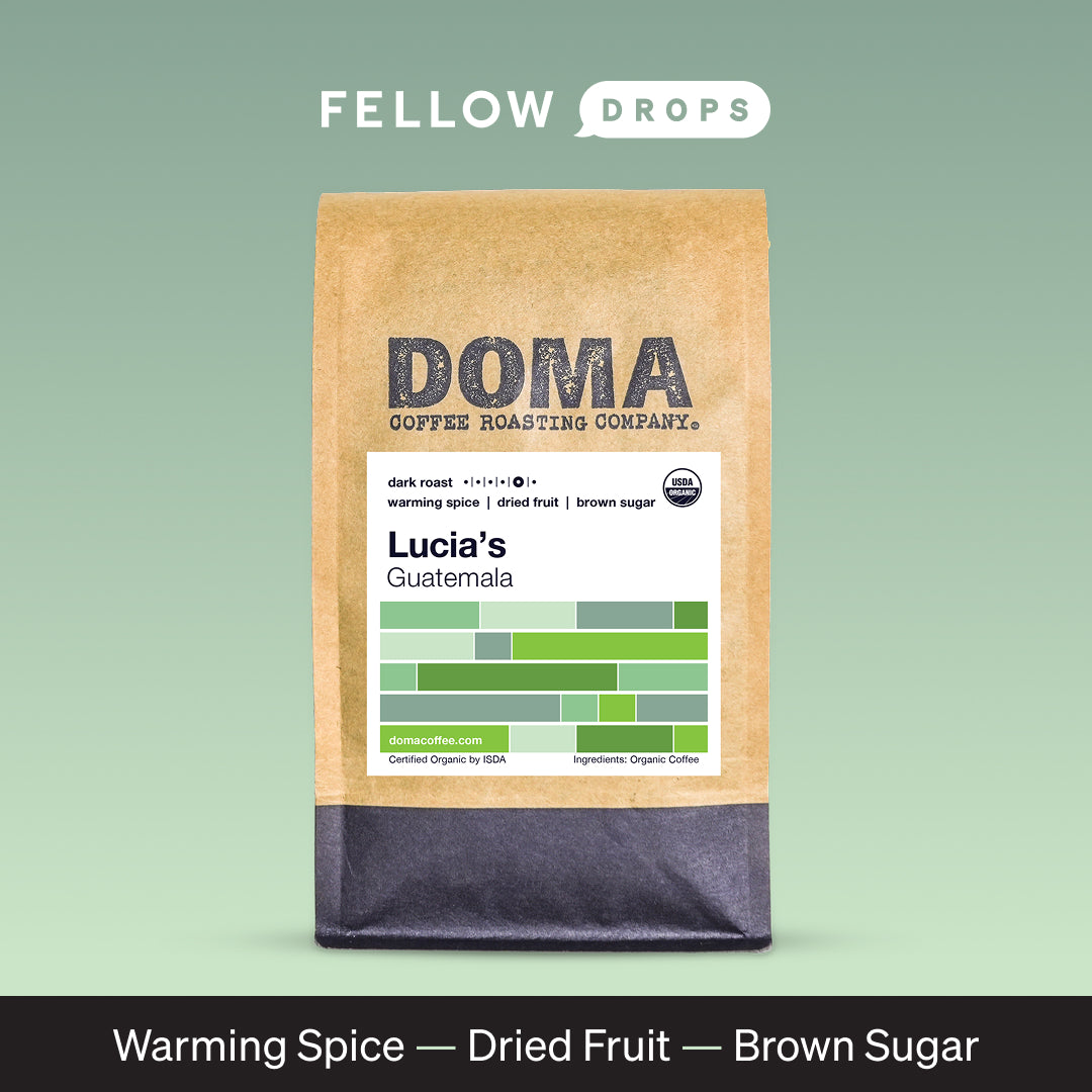 A brown bag labeled Lucia’s Guatemala from DOMA Coffee Roasting Company with flavor notes.