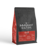 Black and red 250g Olé coffee bag by Immigrant Culture, medium roast, Colombian origin.