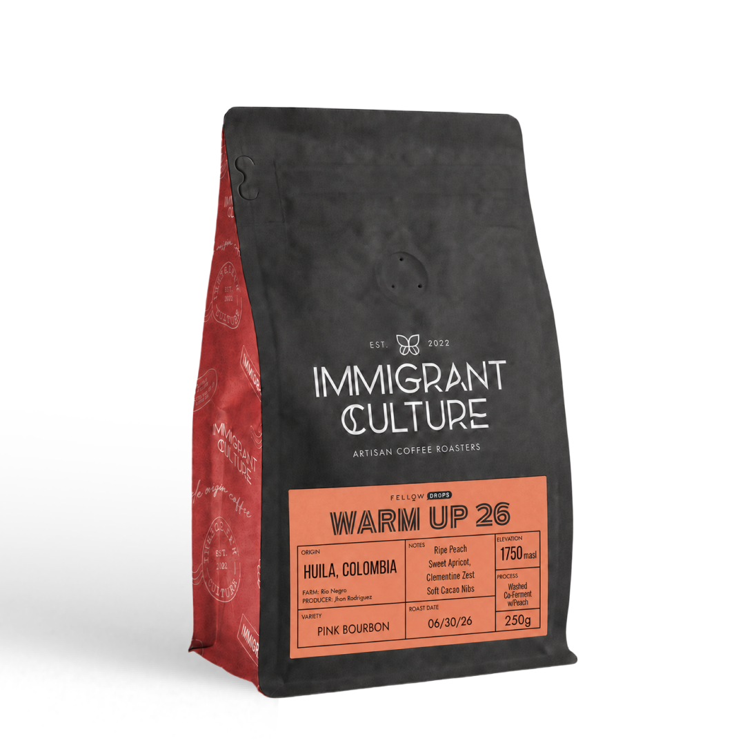 Warm Up 26 light roast bag, black/red, by Immigrant Culture—Huila, Colombia.