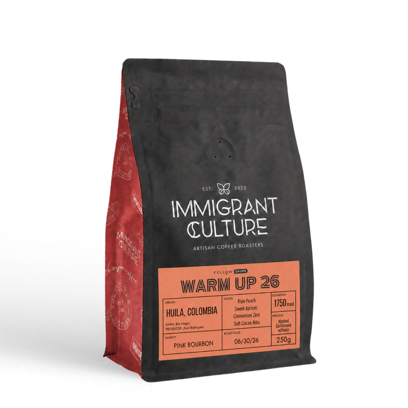 Warm Up 26 light roast bag, black/red, by Immigrant Culture—Huila, Colombia.