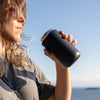 Lifestyle image of matte black move mug