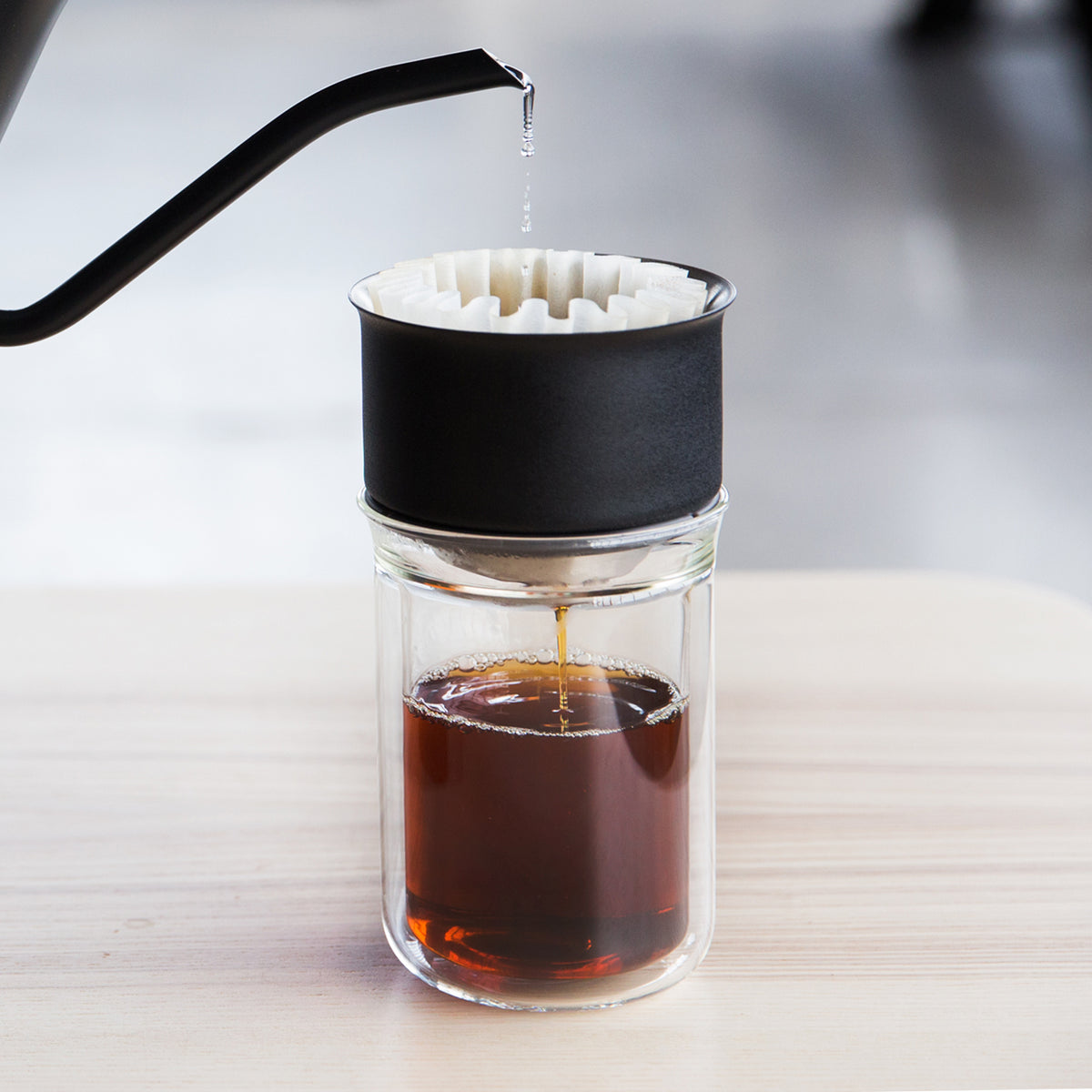 Stagg EKG brewing coffee into Stagg [X] Dripper over a Stagg Tasting Glass