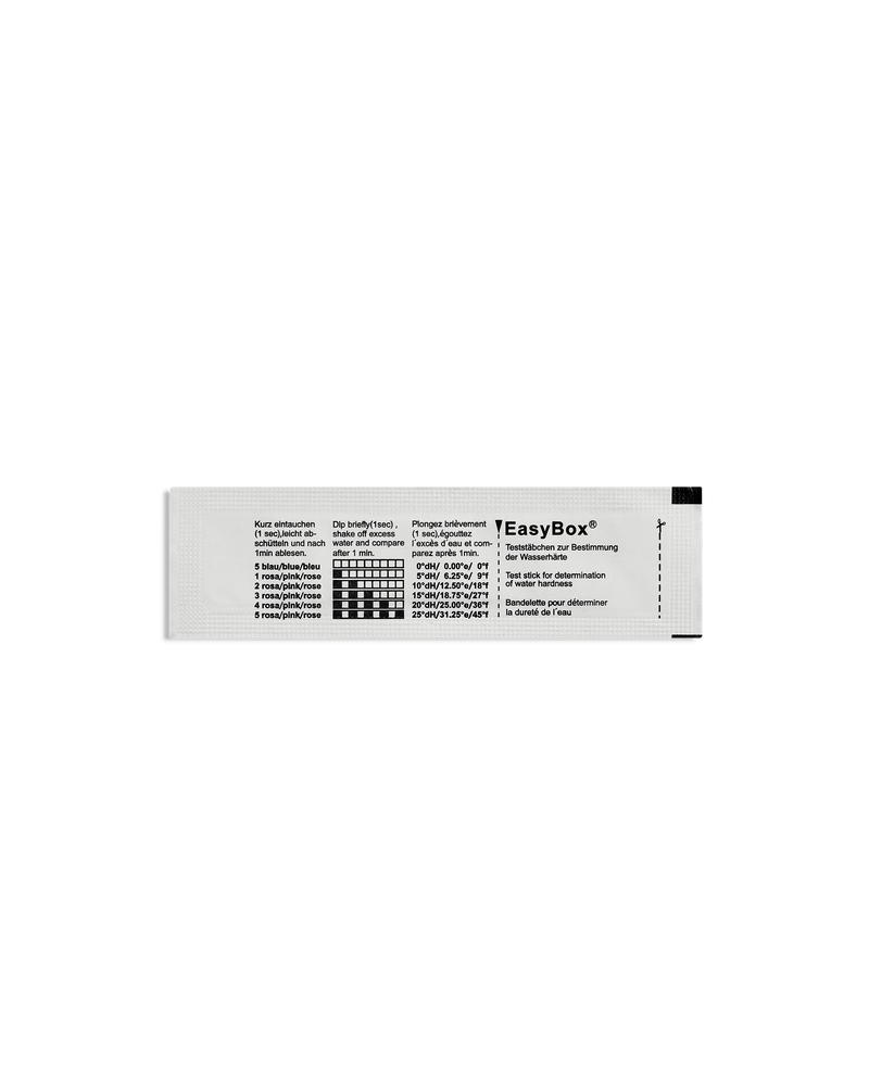 A white Fellow Series 1 Water Hardness Test Strip with text and a black mineral levels chart.