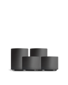 Four matte black Fellow Latte Art Set cups in different sizes on a white background.
