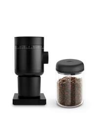 Fellow Grind It Kit: black coffee grinder & airtight bean jar on a white background.